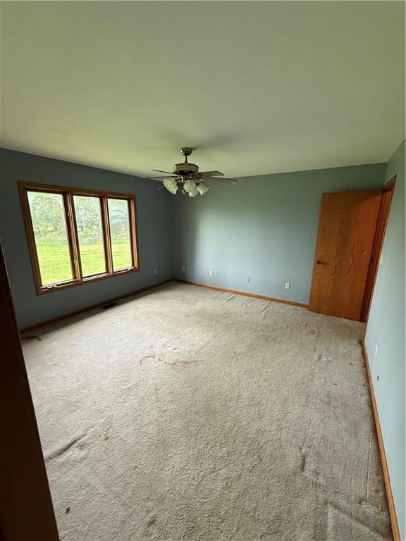 1011 N Arrowhead Dr, Burlington, KS 66839 - empty room with carpet flooring and ceiling fan