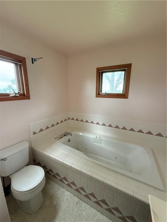 1011 N Arrowhead Dr, Burlington, KS 66839 - bathroom with a whirlpool tub and toilet