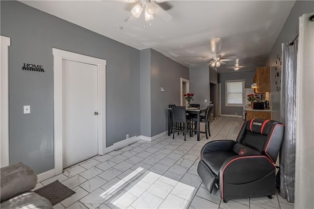 321 Oakley Ave, Kansas City, MO 64123 - living area with a ceiling fan and light marble finish flooring