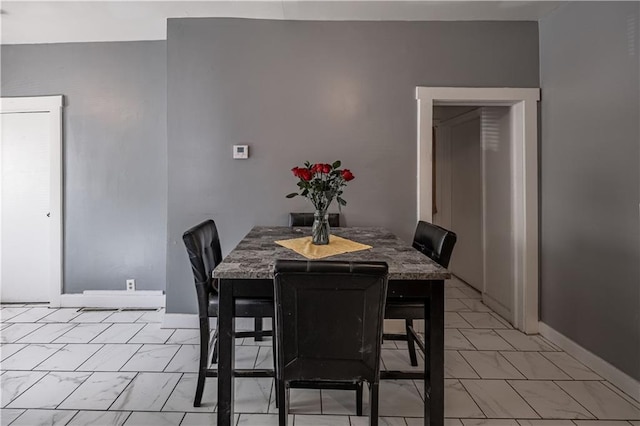 321 Oakley Ave, Kansas City, MO 64123 - dining space with light marble finish floors and baseboards