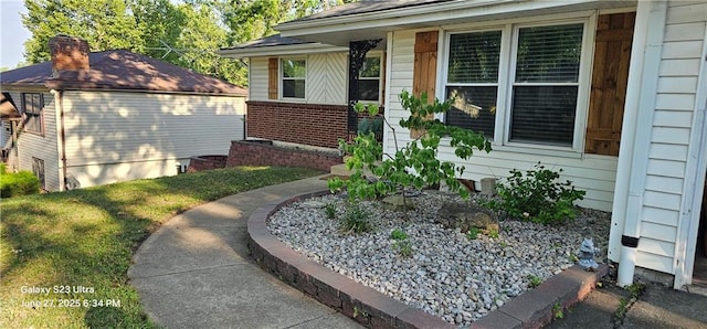 4501 E 105th St, Kansas City, MO 64137 - view of exterior entry featuring brick siding