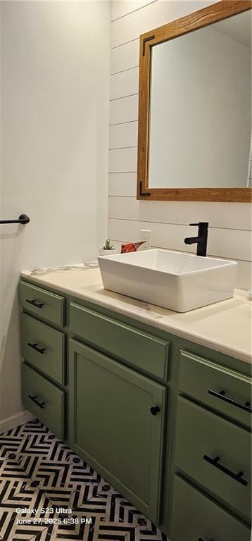 4501 E 105th St, Kansas City, MO 64137 - bathroom with vanity and wood walls