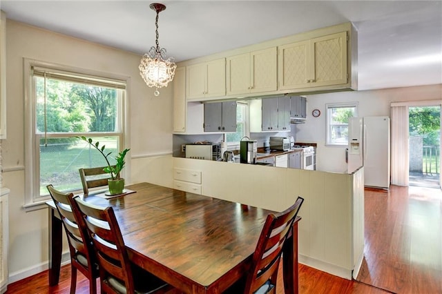 16128 Midland Dr, Shawnee, KS 66217 - dining area featuring wood finished floors and a chandelier