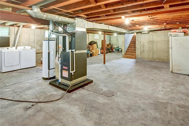 16128 Midland Dr, Shawnee, KS 66217 - unfinished basement featuring water heater, independent washer and dryer, heating unit, stairs, and freestanding refrigerator