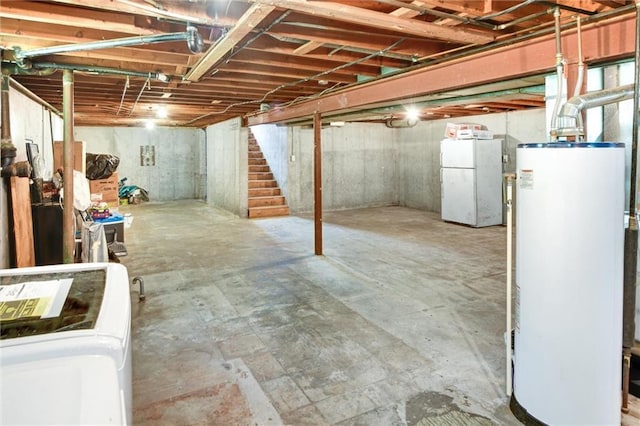 16128 Midland Dr, Shawnee, KS 66217 - unfinished basement featuring water heater, stairway, and freestanding refrigerator
