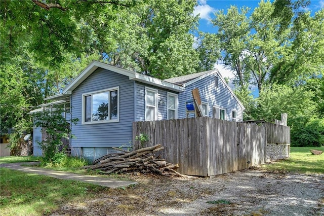 16128 Midland Dr, Shawnee, KS 66217 - view of side of property with an attached garage
