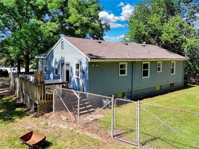 16128 Midland Dr, Shawnee, KS 66217 - back of property with a deck, a shingled roof, and a gate