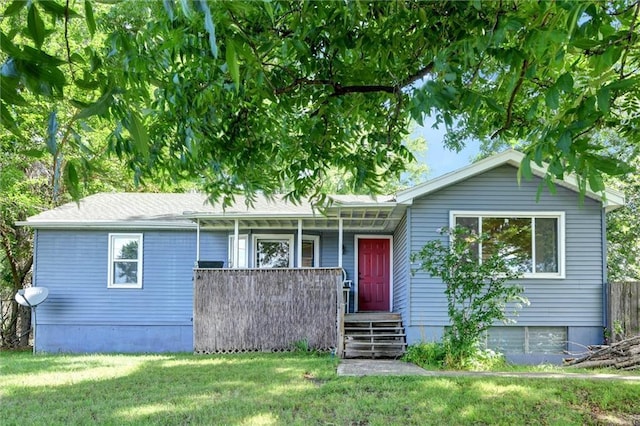 16128 Midland Dr, Shawnee, KS 66217 - view of front of home with a porch and a front lawn