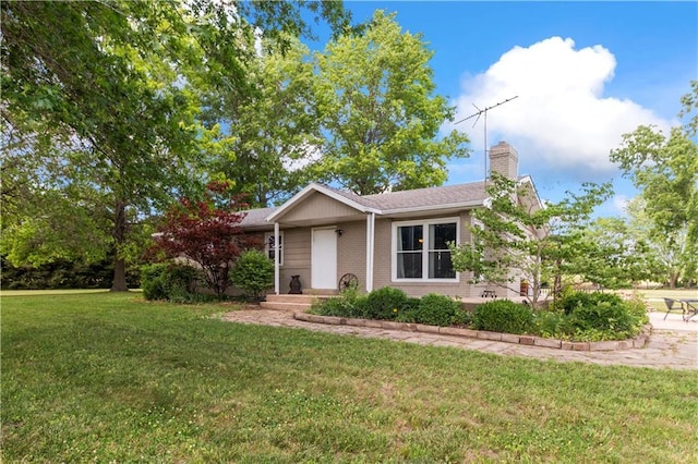 38410 E Cline Rd, Lone Jack, MO 64070 - single story home featuring a chimney, a front lawn, and brick siding