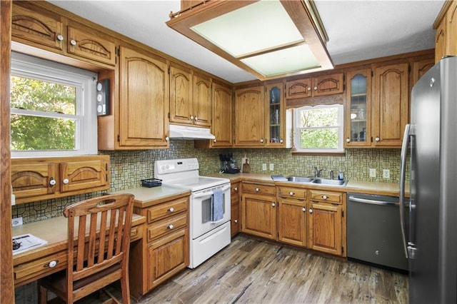 38410 E Cline Rd, Lone Jack, MO 64070 - kitchen featuring stainless steel appliances, under cabinet range hood, brown cabinetry, and light countertops