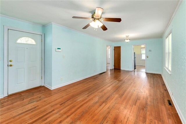2731 S Northern Blvd, Independence, MO 64052 - foyer entrance featuring wood finished floors, a ceiling fan, and ornamental molding