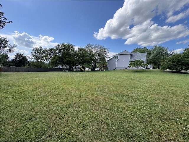 200 S Park Dr, Raymore, MO 64083 - view of yard featuring a playground