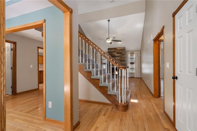 200 S Park Dr, Raymore, MO 64083 - entryway with wood finished floors, a ceiling fan, stairs, and vaulted ceiling