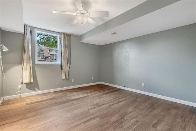 200 S Park Dr, Raymore, MO 64083 - empty room with wood finished floors and ceiling fan