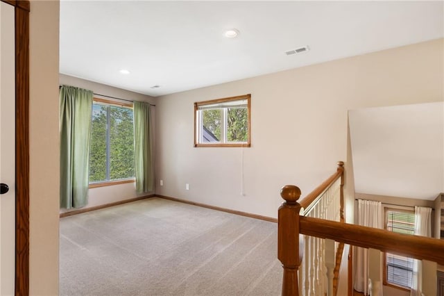 200 S Park Dr, Raymore, MO 64083 - carpeted spare room featuring healthy amount of natural light and recessed lighting