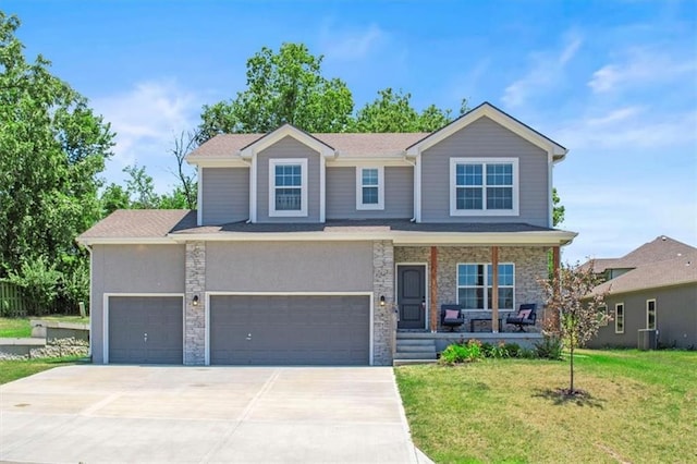 801 NW Hickory Ridge Dr, Grain Valley, MO 64029 - view of front of house with covered porch, driveway, a front yard, stone siding, and a garage
