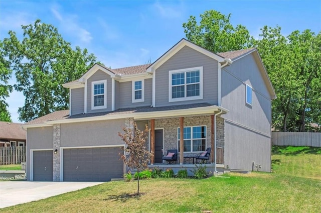 801 NW Hickory Ridge Dr, Grain Valley, MO 64029 - view of front facade featuring covered porch, stone siding, concrete driveway, and an attached garage