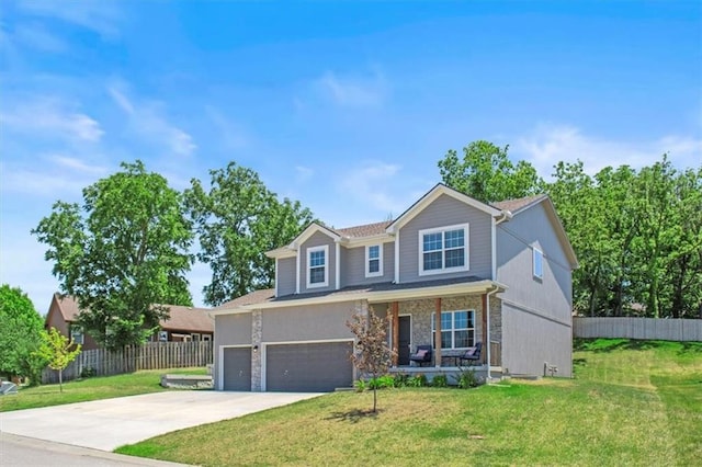 801 NW Hickory Ridge Dr, Grain Valley, MO 64029 - traditional home featuring covered porch, concrete driveway, an attached garage, and stone siding