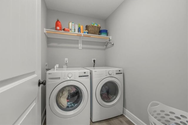 801 NW Hickory Ridge Dr, Grain Valley, MO 64029 - washroom featuring separate washer and dryer and light wood-style flooring