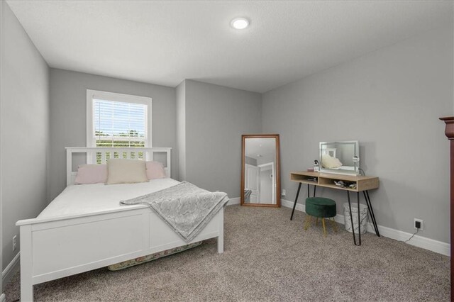 801 NW Hickory Ridge Dr, Grain Valley, MO 64029 - bedroom featuring carpet and baseboards