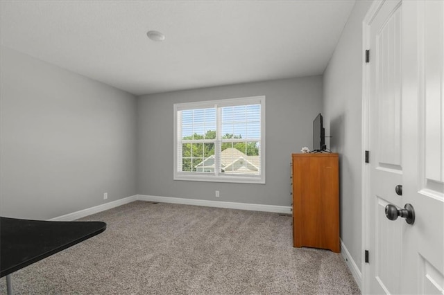 801 NW Hickory Ridge Dr, Grain Valley, MO 64029 - unfurnished bedroom with carpet flooring and baseboards