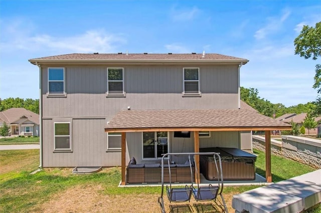 801 NW Hickory Ridge Dr, Grain Valley, MO 64029 - rear view of property featuring a hot tub, a yard, and a patio