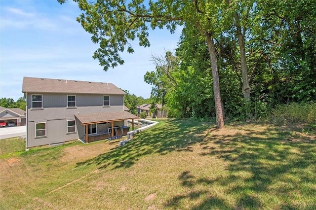 801 NW Hickory Ridge Dr, Grain Valley, MO 64029 - back of house featuring a yard