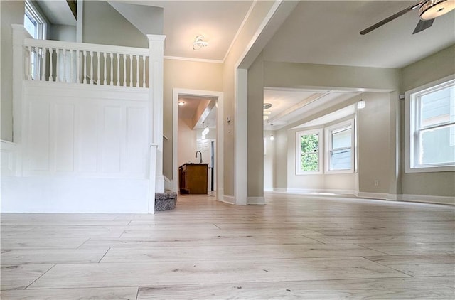 3635 Wabash Ave, Kansas City, MO 64109 - entrance foyer featuring ceiling fan, light wood-style floors, and crown molding