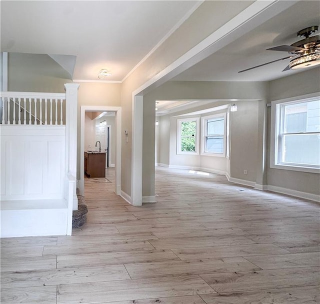 3635 Wabash Ave, Kansas City, MO 64109 - empty room featuring ceiling fan, light wood-type flooring, and ornamental molding