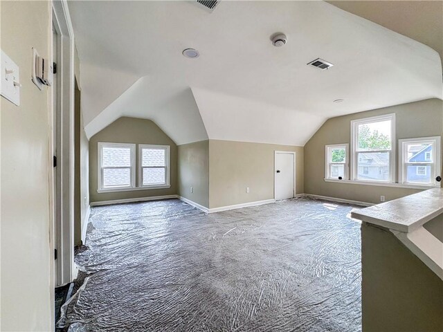 3635 Wabash Ave, Kansas City, MO 64109 - additional living space with carpet floors and lofted ceiling