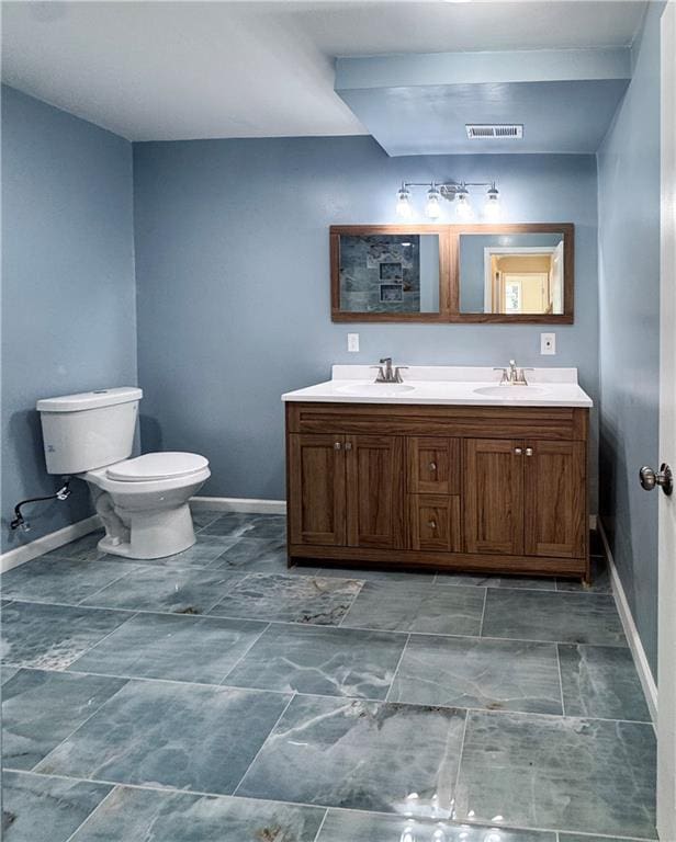 3635 Wabash Ave, Kansas City, MO 64109 - bathroom featuring double vanity and baseboards