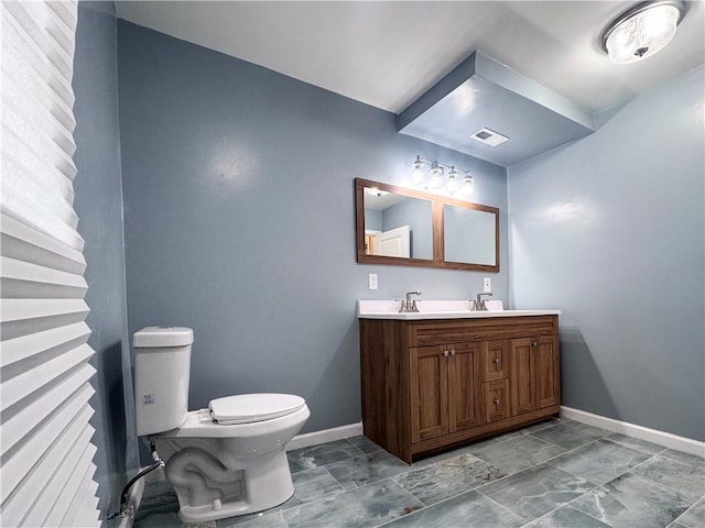3635 Wabash Ave, Kansas City, MO 64109 - bathroom with vanity and marble look tile flooring