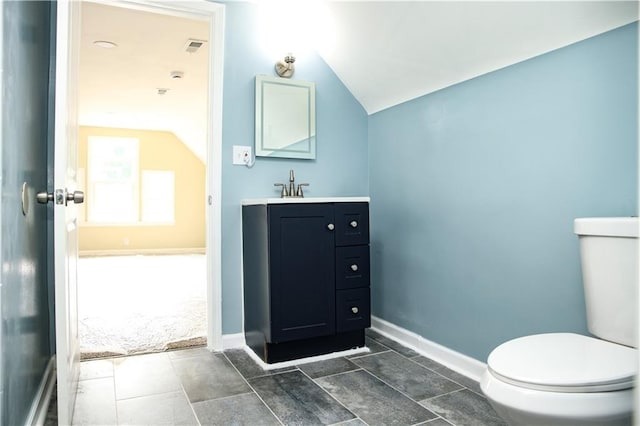 3635 Wabash Ave, Kansas City, MO 64109 - bathroom with vaulted ceiling and vanity