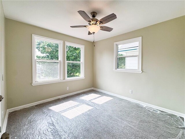 3635 Wabash Ave, Kansas City, MO 64109 - carpeted empty room with a ceiling fan and baseboards