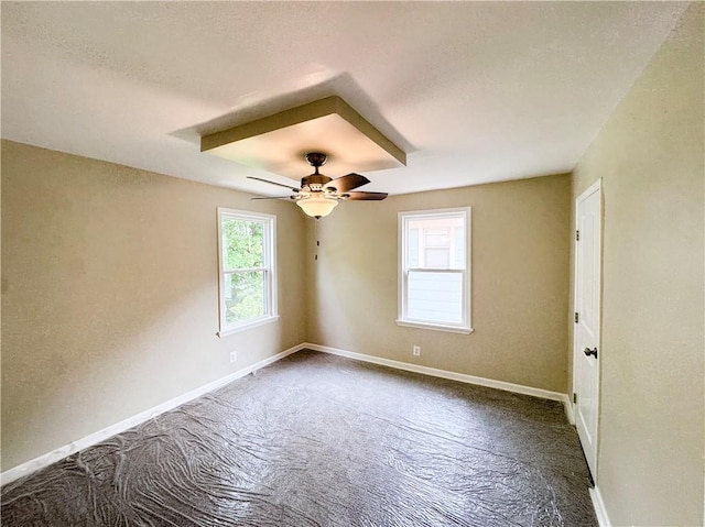3635 Wabash Ave, Kansas City, MO 64109 - empty room with dark carpet and ceiling fan