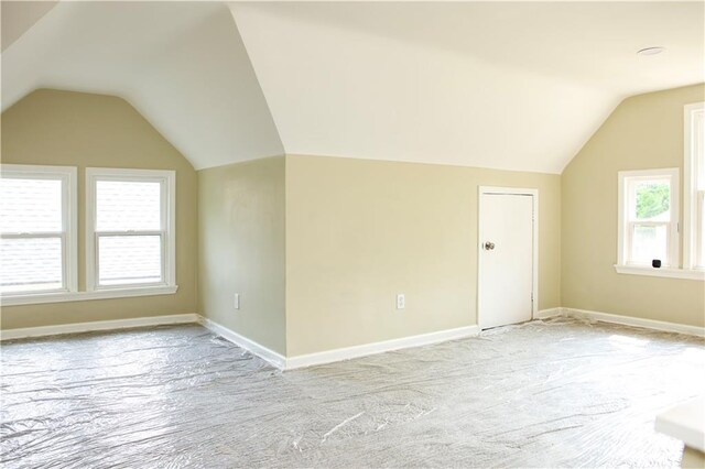 3635 Wabash Ave, Kansas City, MO 64109 - additional living space featuring lofted ceiling, light colored carpet, and plenty of natural light