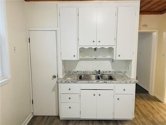 812 N 9th St, Leavenworth, KS 66048 - kitchen featuring wood finished floors, white cabinets, wood ceiling, crown molding, and light stone counters