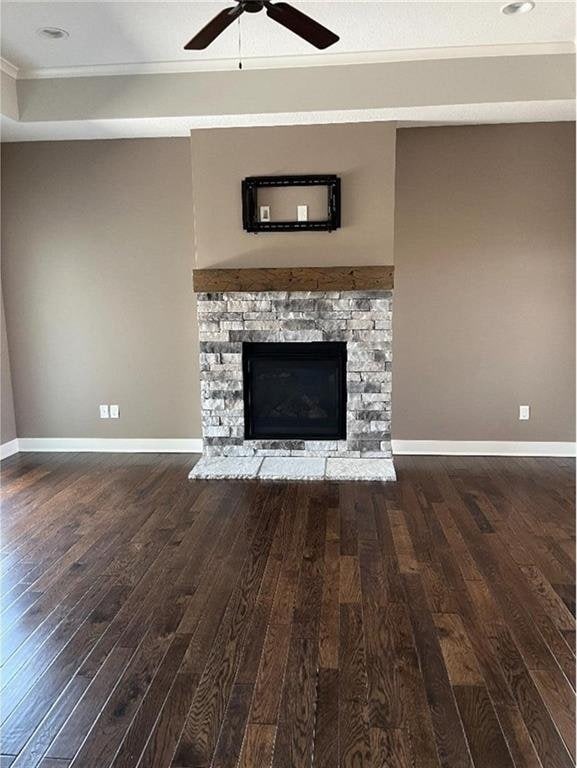 15653 Lakeside Dr, Basehor, KS 66007 - unfurnished living room with ceiling fan, wood-type flooring, a fireplace, and crown molding