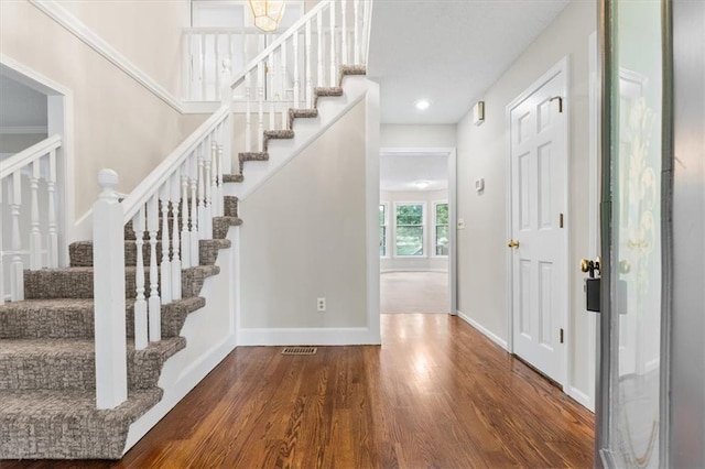 13942 W 113th St, Olathe, KS 66215 - entryway featuring wood finished floors, stairway, and recessed lighting