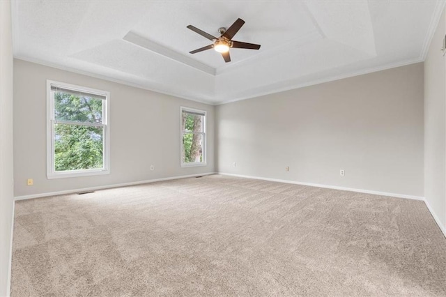 13942 W 113th St, Olathe, KS 66215 - carpeted empty room with a raised ceiling, a ceiling fan, and ornamental molding