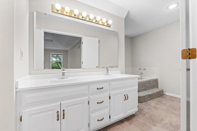 13942 W 113th St, Olathe, KS 66215 - bathroom with double vanity and a bath