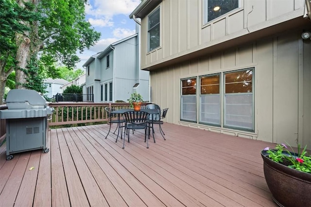13942 W 113th St, Olathe, KS 66215 - wooden terrace with outdoor dining space and grilling area
