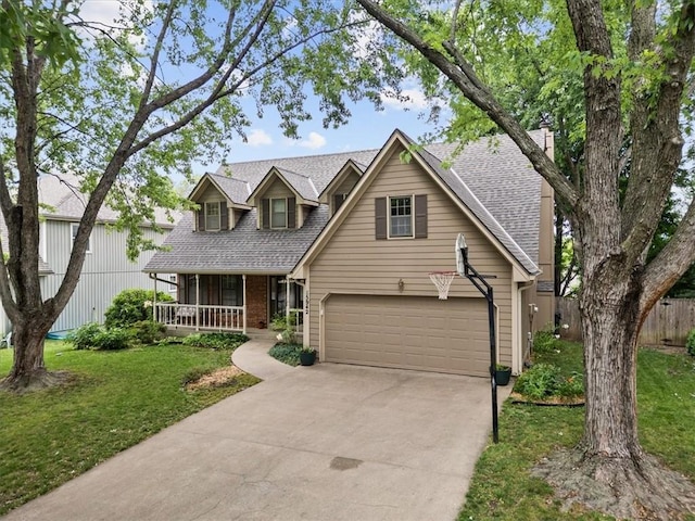 13942 W 113th St, Olathe, KS 66215 - view of front of house featuring covered porch, driveway, roof with shingles, and brick siding