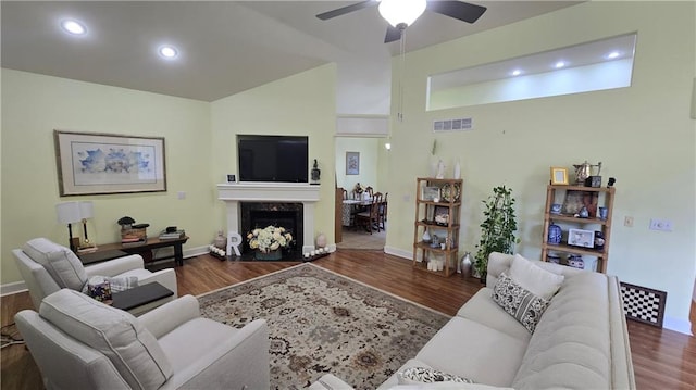 16810 NE 170th Ter, Holt, MO 64048 - living room with lofted ceiling, wood finished floors, ceiling fan, a high end fireplace, and recessed lighting