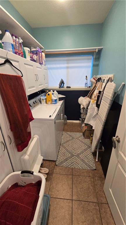 16810 NE 170th Ter, Holt, MO 64048 - washroom with washing machine and dryer and tile patterned flooring