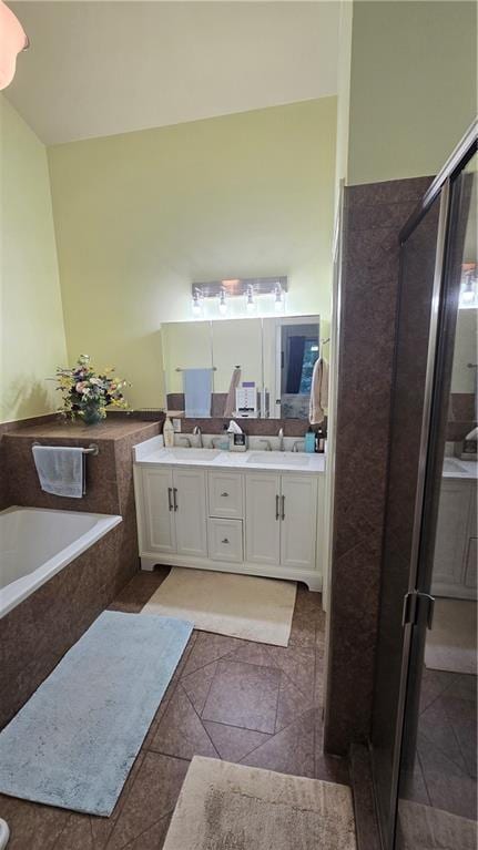 16810 NE 170th Ter, Holt, MO 64048 - bathroom featuring double vanity, a garden tub, tile patterned floors, and a stall shower