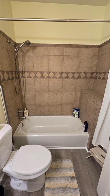 16810 NE 170th Ter, Holt, MO 64048 - full bathroom featuring wood finished floors and bathing tub / shower combination