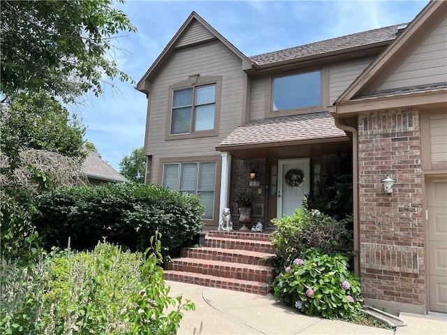 505 Williamsburg Dr, Lees Summit, MO 64063 - view of front facade featuring roof with shingles and a garage