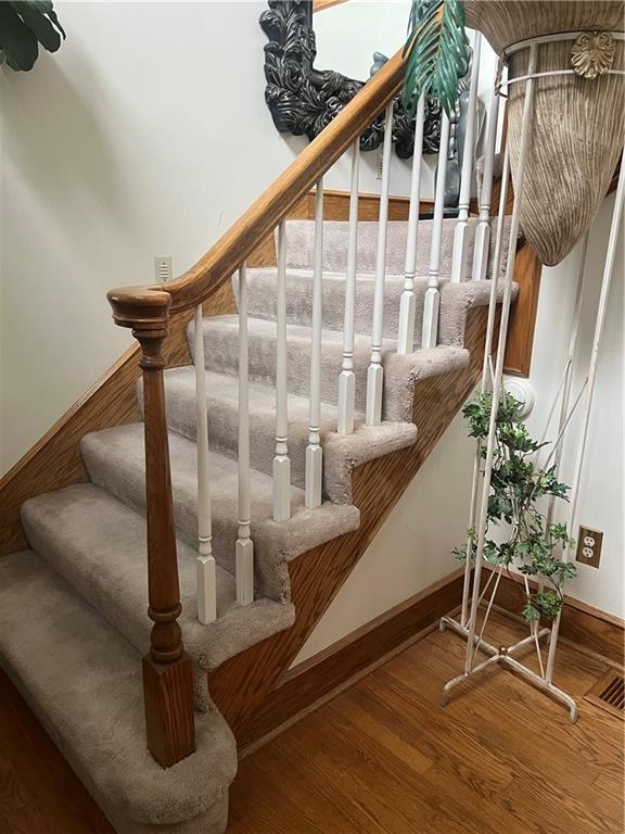 505 Williamsburg Dr, Lees Summit, MO 64063 - staircase with wood finished floors