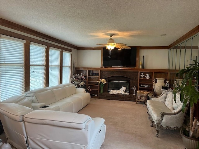 505 Williamsburg Dr, Lees Summit, MO 64063 - living area featuring a ceiling fan, ornamental molding, carpet, a textured ceiling, and a fireplace